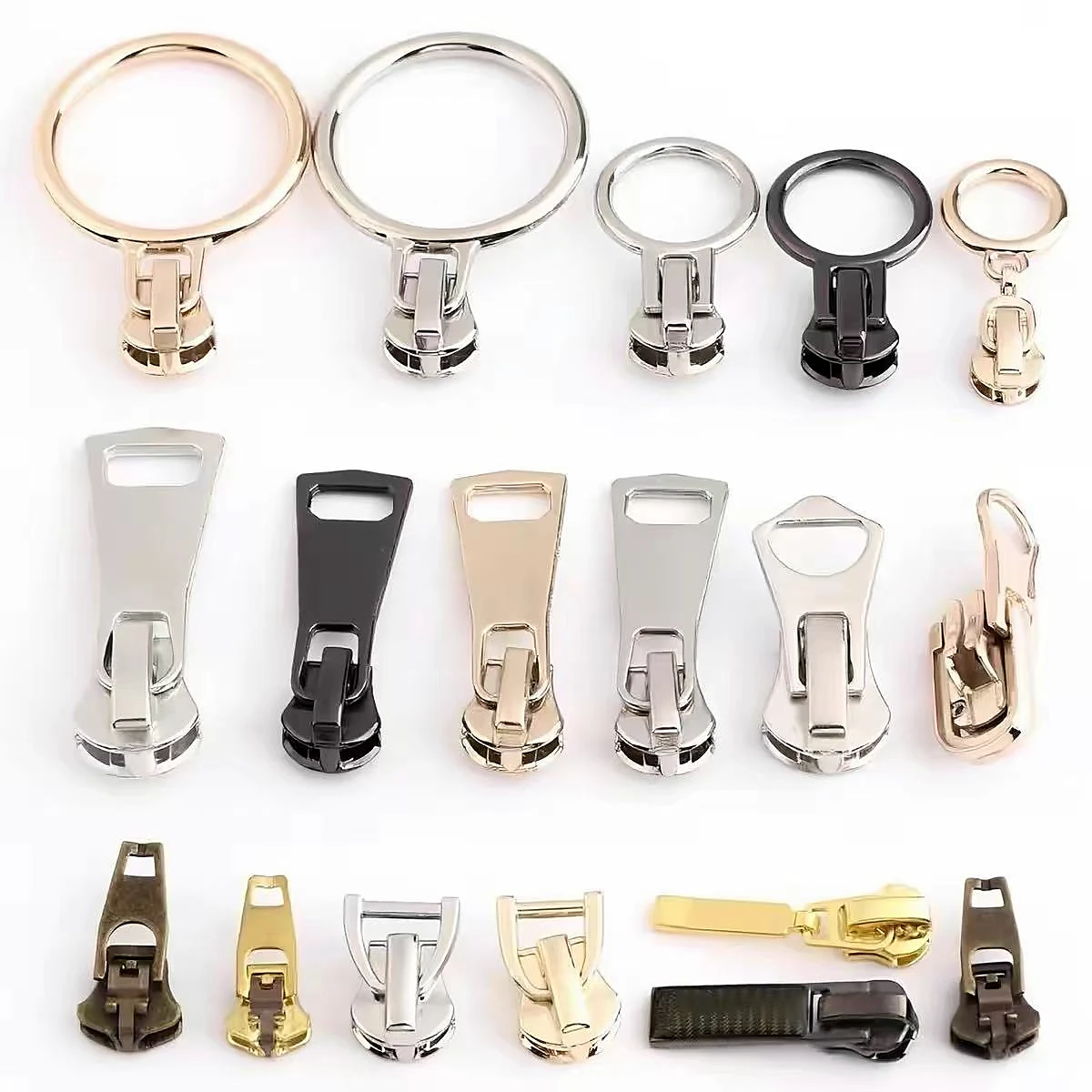Assortment of ring, geometric and tab-style zipper pullers in multiple finishes