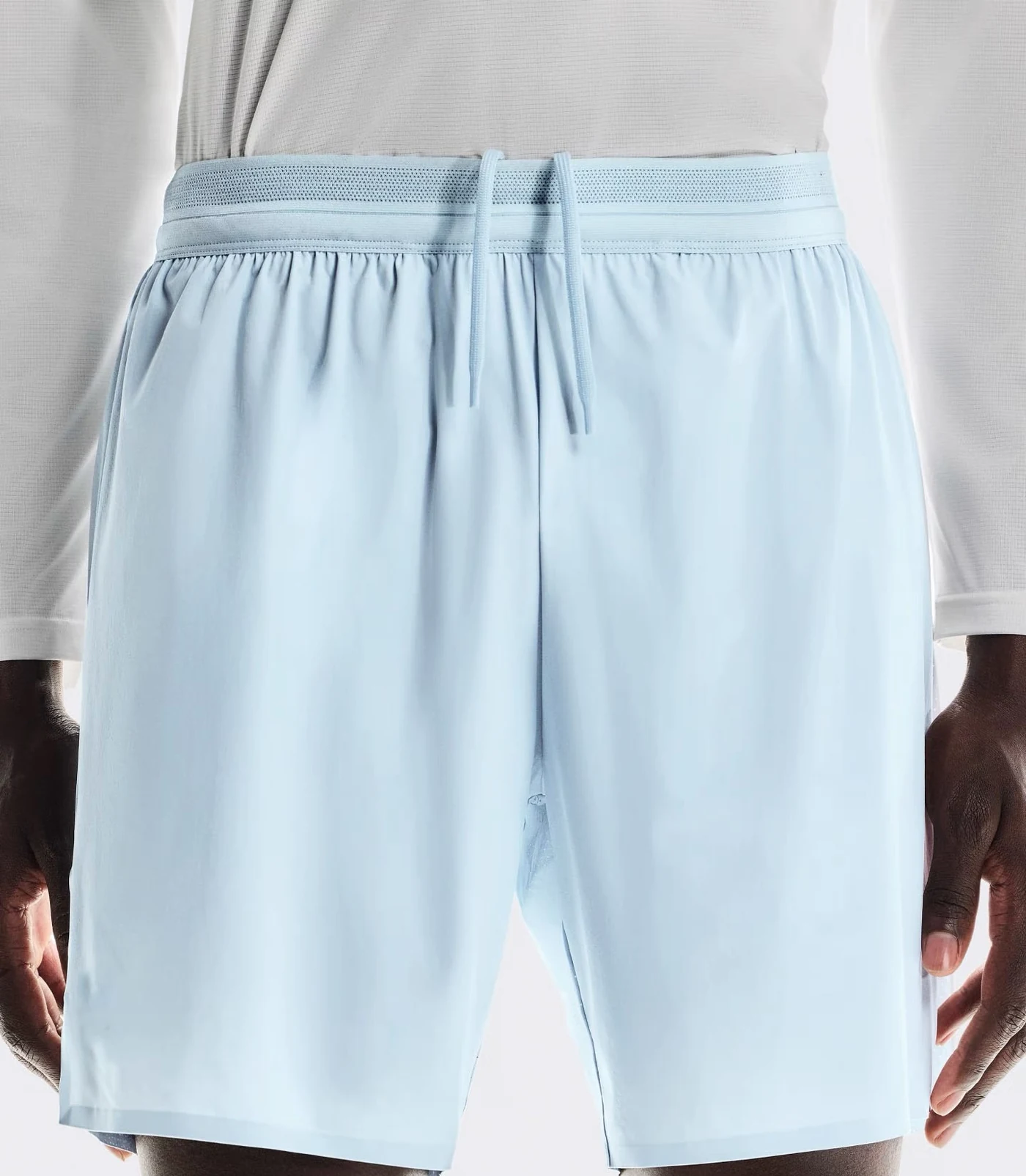 Light blue activewear shorts with a breathable functional waistband