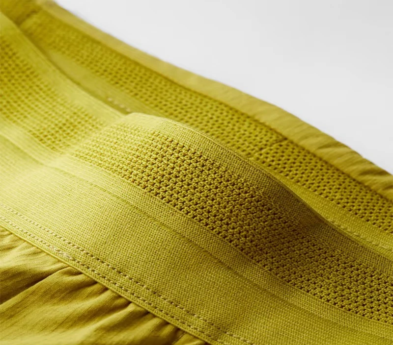 Close-up of a breathable knitted functional waistband sewn into sportswear