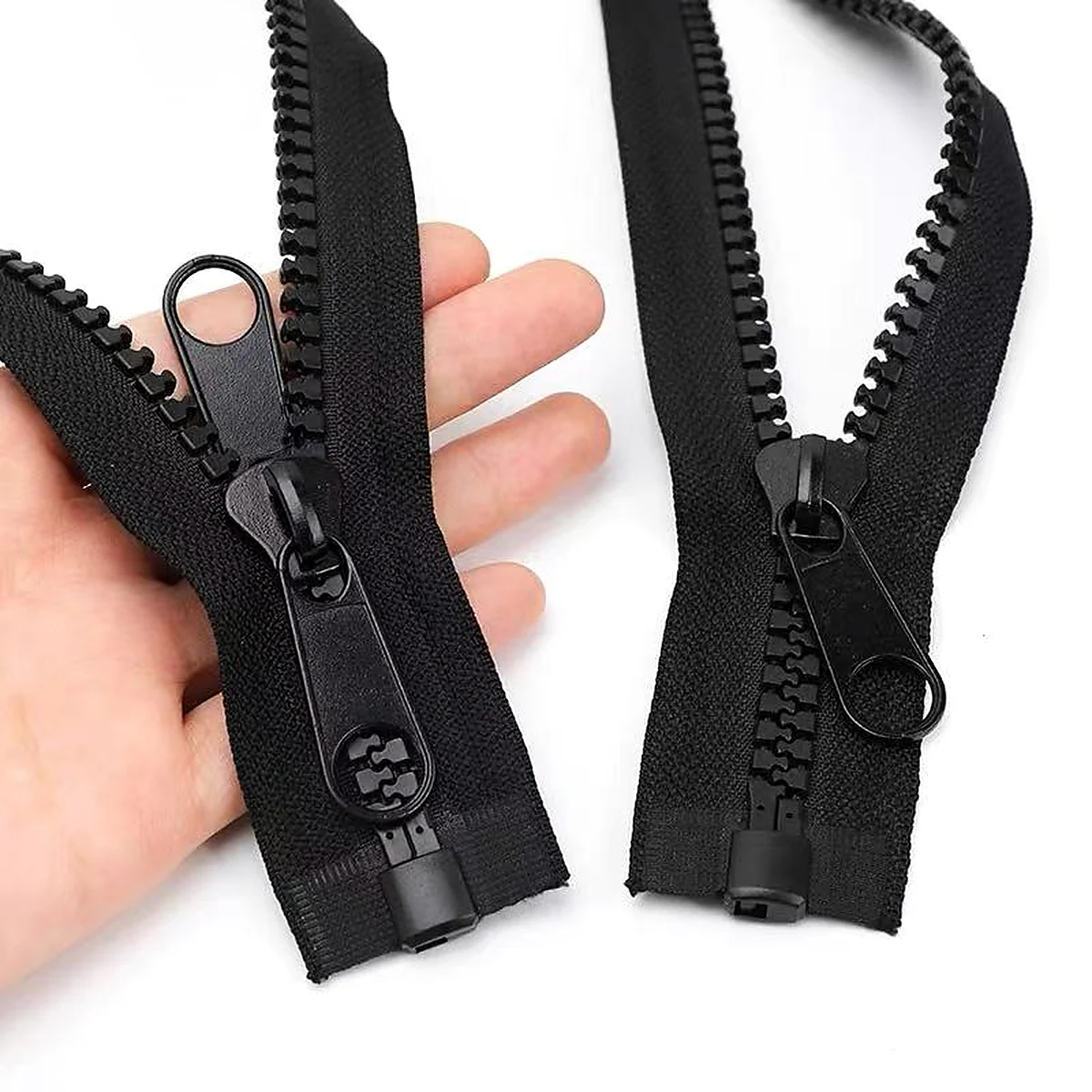 Black plastic molded open-end zippers with ring pullers